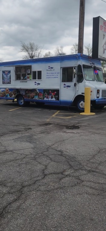 Side view of the DeliJey truck showing the row of food pictures painted along the body
